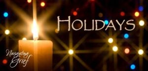 candle with holidays in text and sparkling background